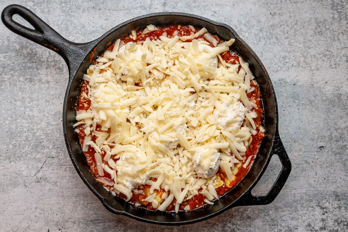 Ricotta and mozzarella cheese added to the skillet lasagna.