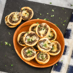 Tartlets with cream cheese pastry filled with mushroom duxelles and fontina cheese.
