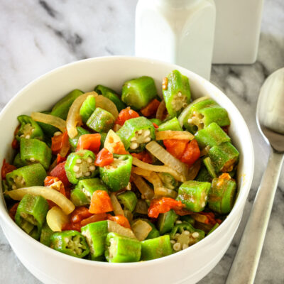 Okra and tomatoes in a bowl.