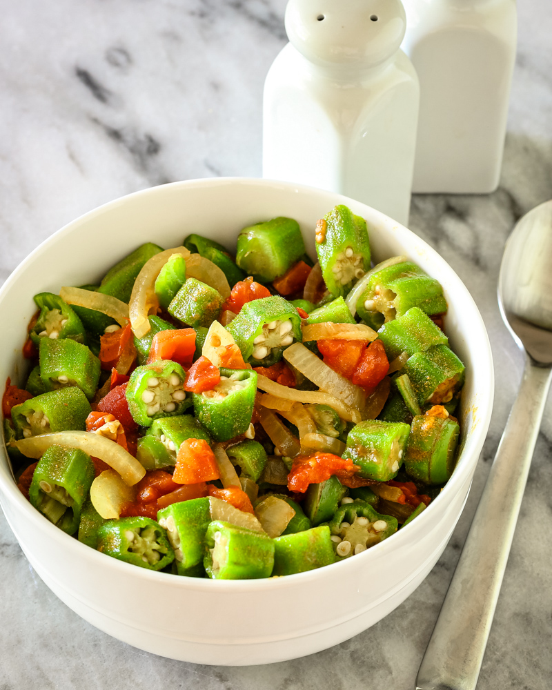 Okra and tomatoes in a bowl.