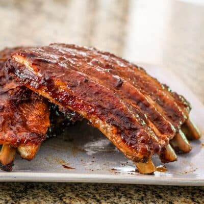Oven barbecued spareribs on a plate.