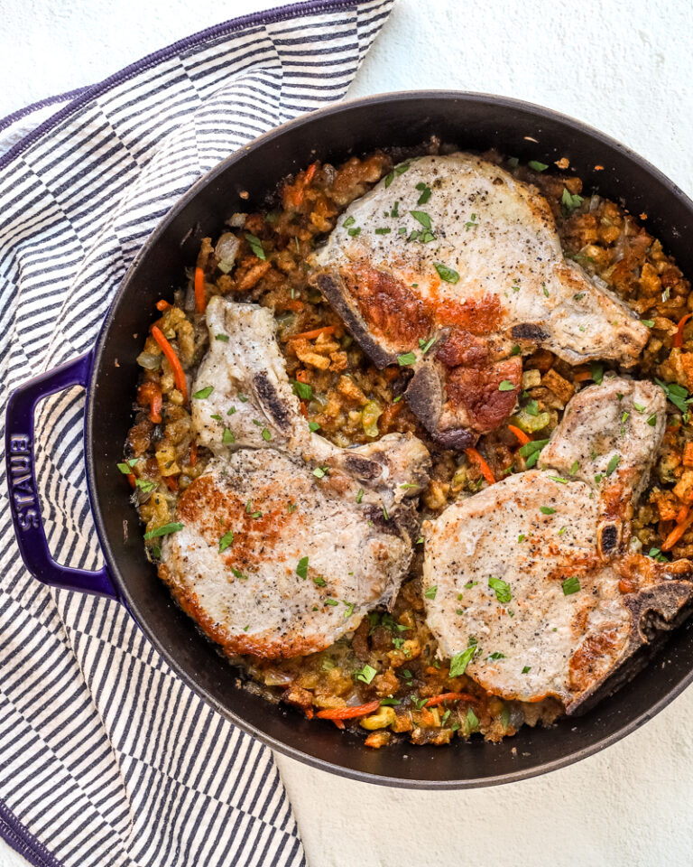 pan with seasoned stuffing and pork chops baked in the oven.