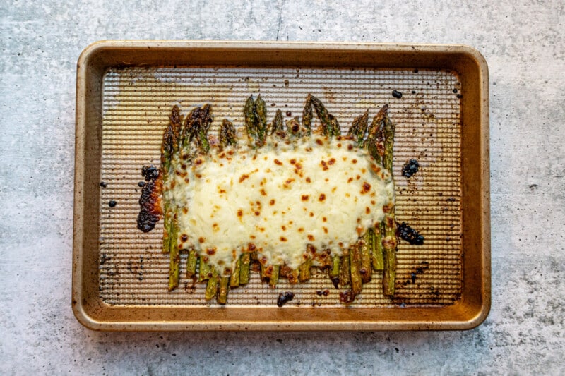 Salt and pepper asparagus with broiled mozzarella cheese topping.