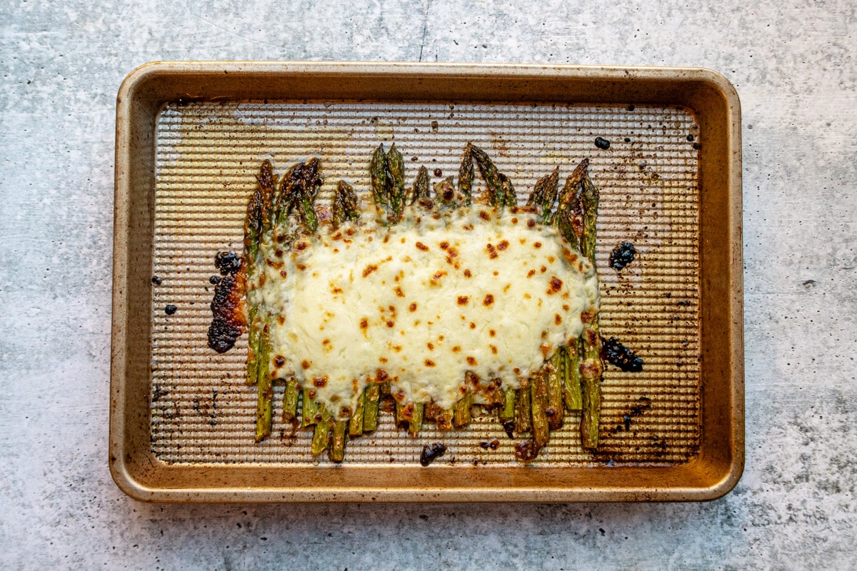 Salt and pepper asparagus with broiled mozzarella cheese topping.