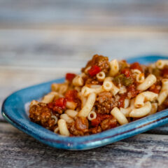 A small plate of macaroni and ground beef.
