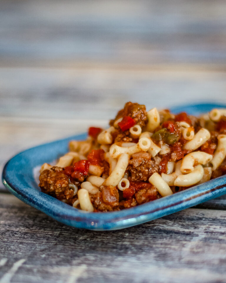 A small plate of macaroni and ground beef.