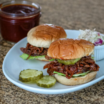 Slow cooker bbq beef sandwiches in slider buns.
