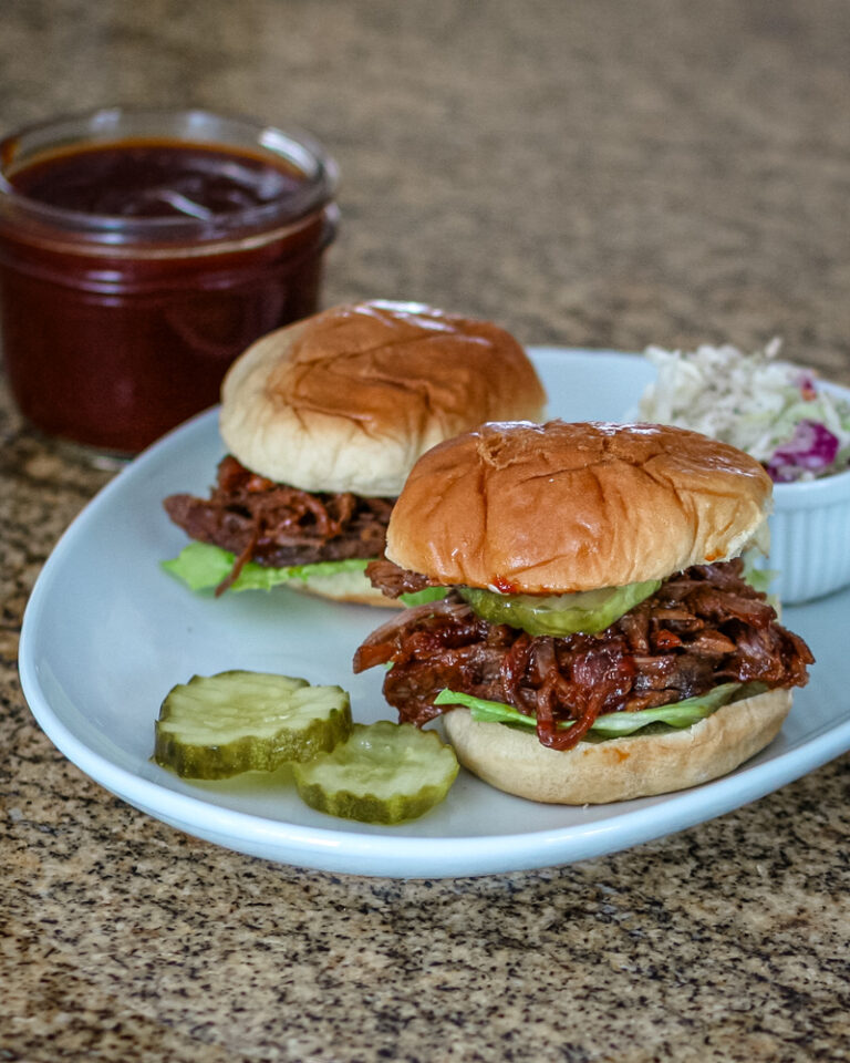 Slow cooker bbq beef sandwiches in slider buns.