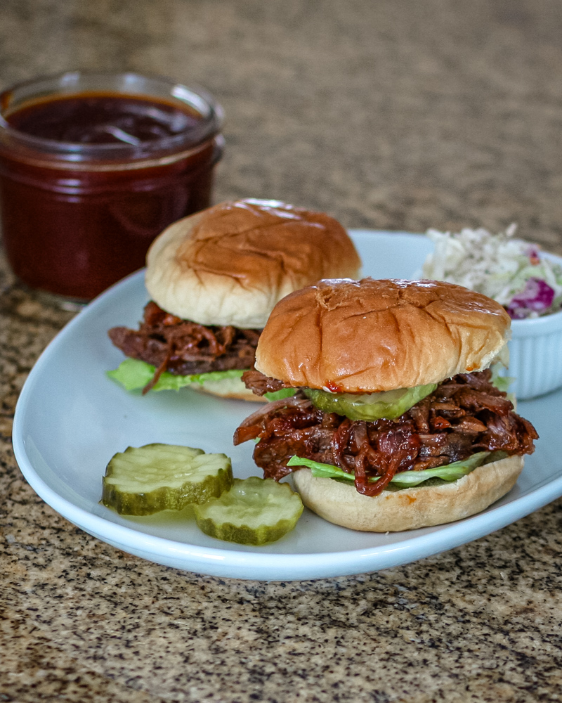 Slow cooker bbq beef sandwiches in slider buns.