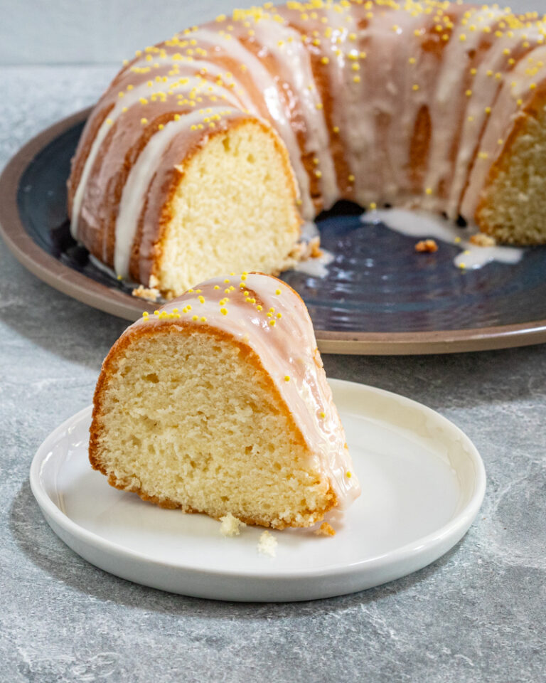 Sour cream lemon cake on a plate.