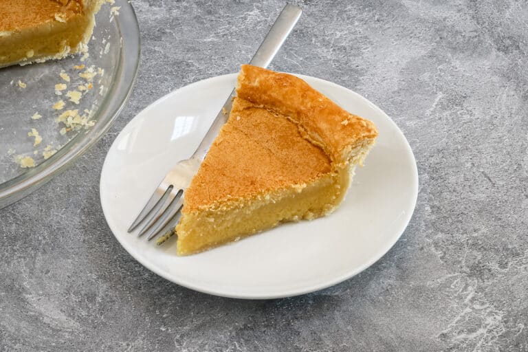 Chess pie on a white plate wit a fork.
