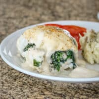 Baked stuffed flounder fillets with spinach.