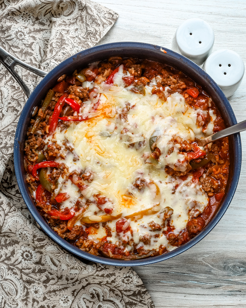 Stuffed pepper casserole with melted fontina cheese, a one pot meal made in a skillet and baked.