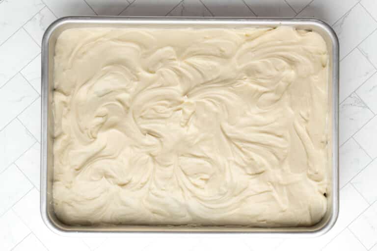 Frosted rectangular zucchini carrot cake.