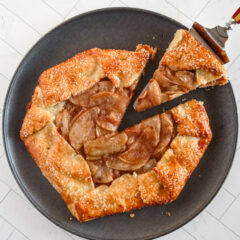 Golden apple galette with a flaky crust and caramelized apple filling.
