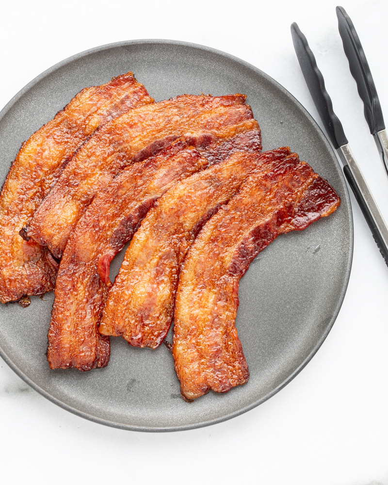 A plate of baked bacon.