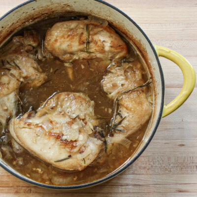 braised chicken with rosemary in a dutch oven