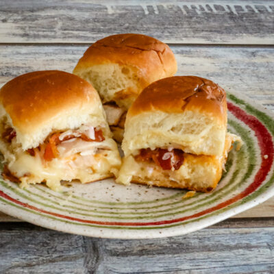Chicken sliders on a plate.