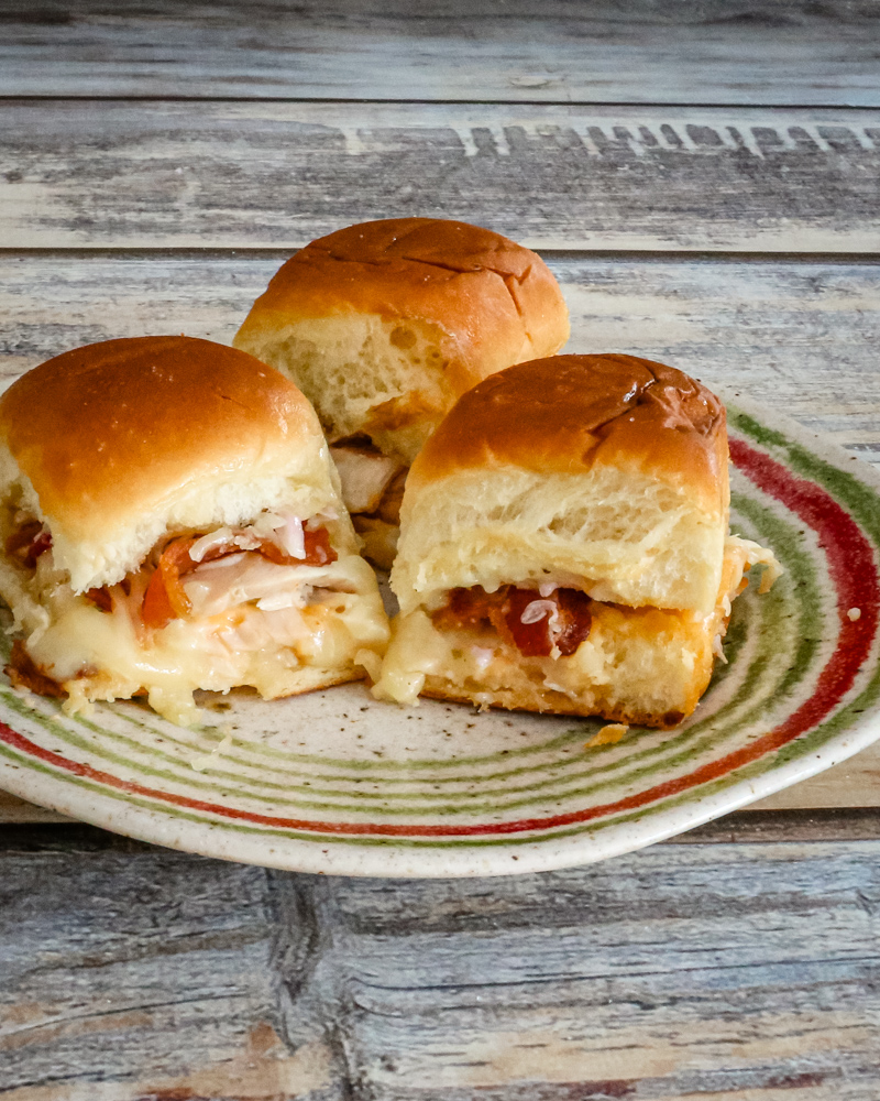 Chicken sliders on a plate.