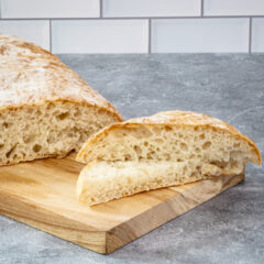 homemade ciabatta bread on a cutting board