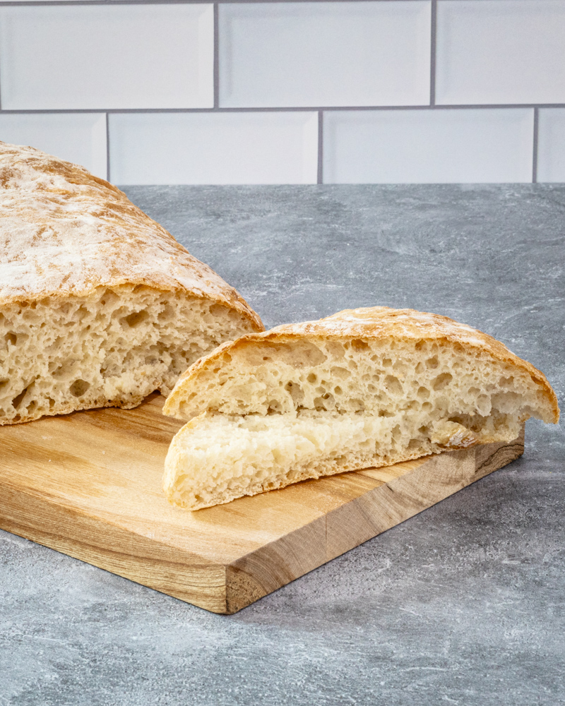 homemade ciabatta bread on a cutting board