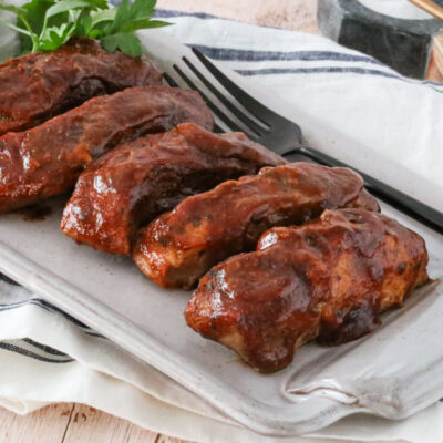 country style ribs with maple bbq sauce on a platter
