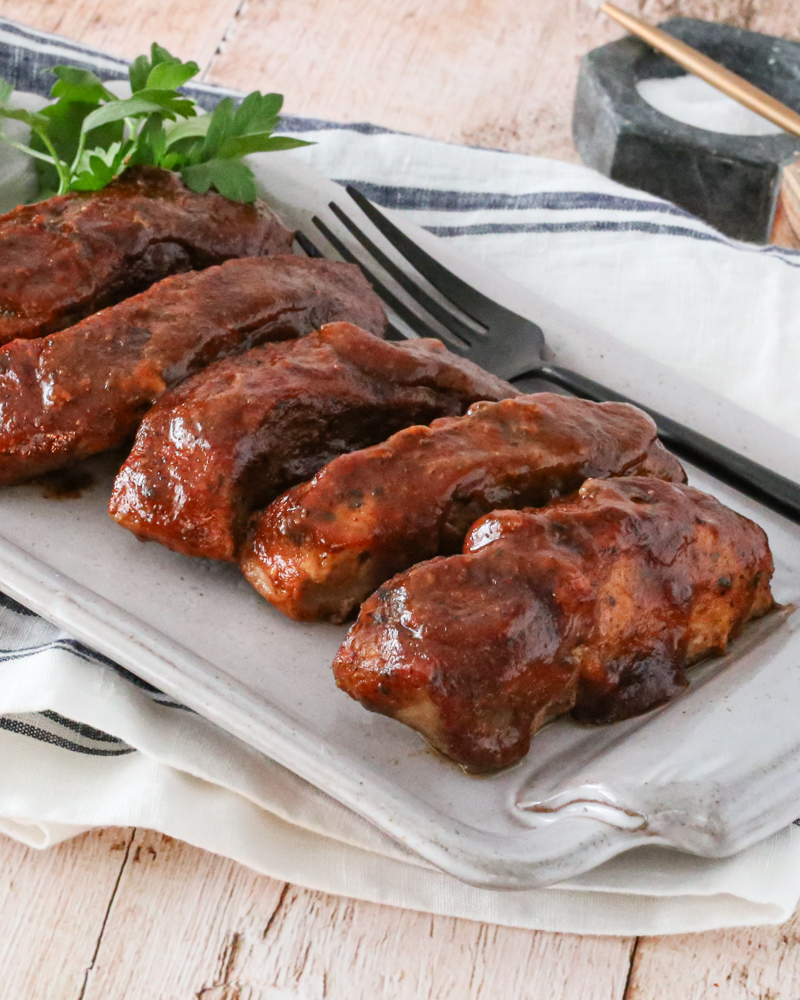 country style ribs with maple bbq sauce on a platter