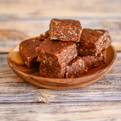 Crispy chocolate fudge on a wooden serving dish.