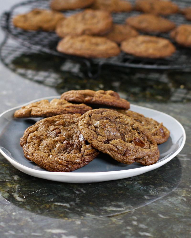 Cookies on a blue and white plate with more cookies in the background.