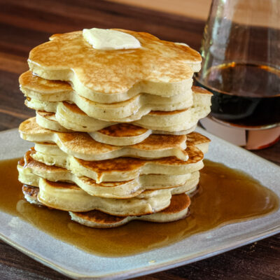 A stack of pancakes with syrup.