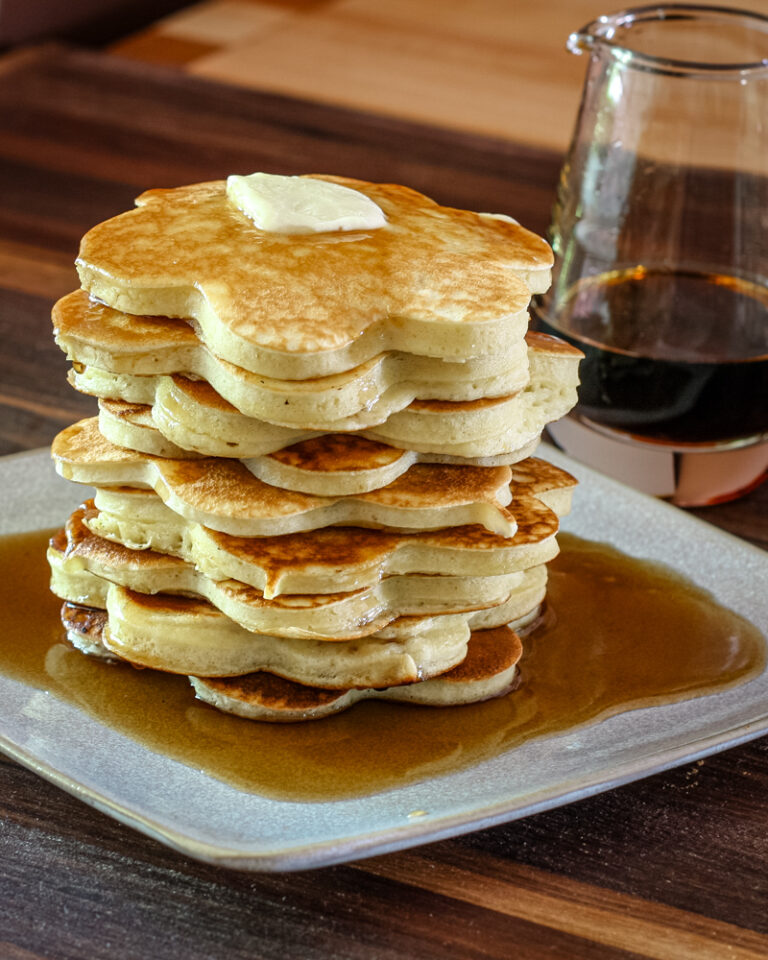 A stack of pancakes with syrup.