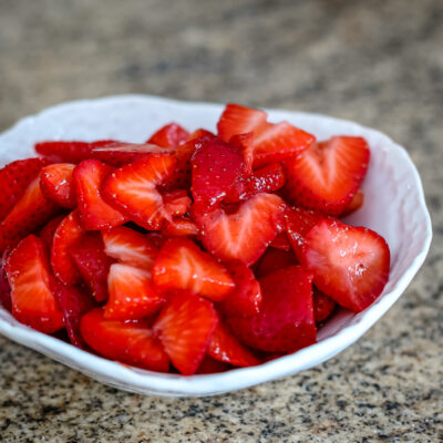 Fresh strawberry sauce in a white bowl