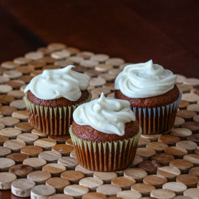 Gingerbread cupcakes topped with creamy vanilla frosting.