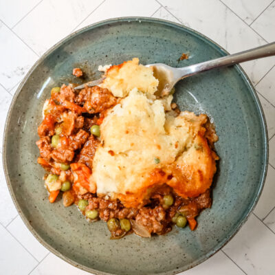 A serving of gluten free cottage pie in a bowl.