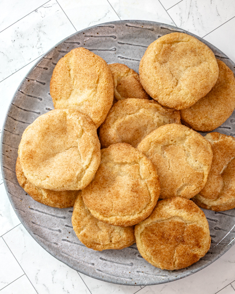 Gluten-free snickerdoodles on a gray plate.
