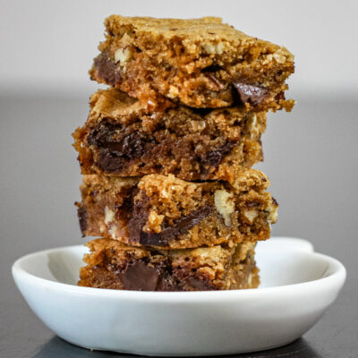 A stack of graham blondies with chocolate chips.