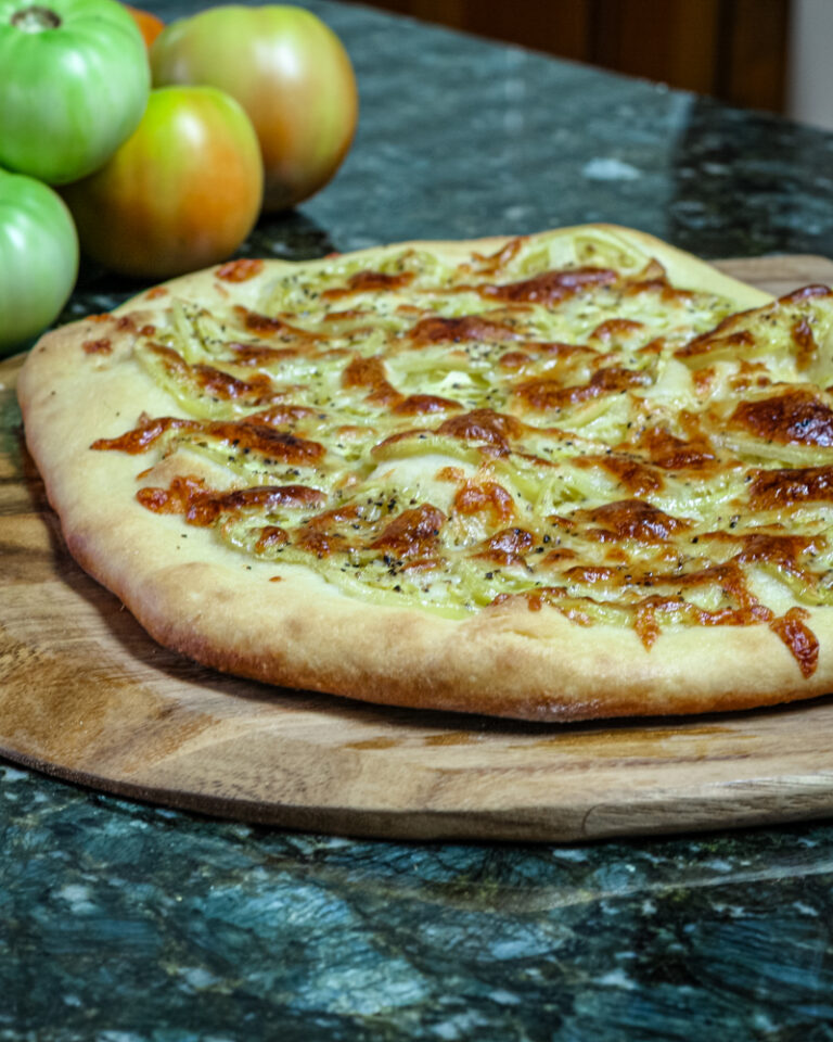 green tomato pizza on homemade crust