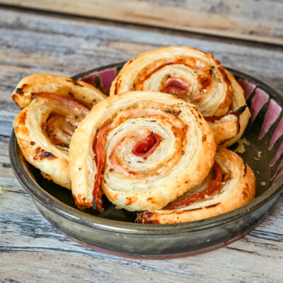 ham and honey mustard pinwheels appetizer in a small dish.