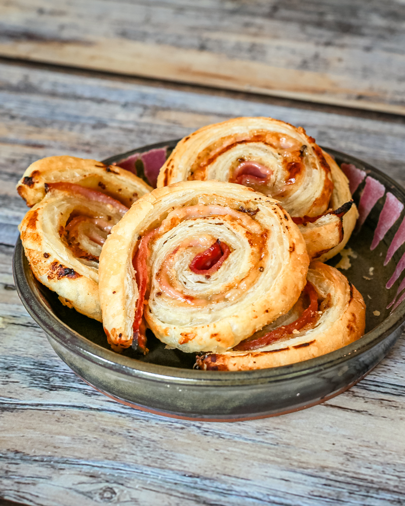 ham and honey mustard pinwheels appetizer in a small dish.