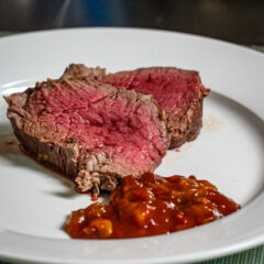 Henry Bain sauce alongside slices of roast beef tenderloin.