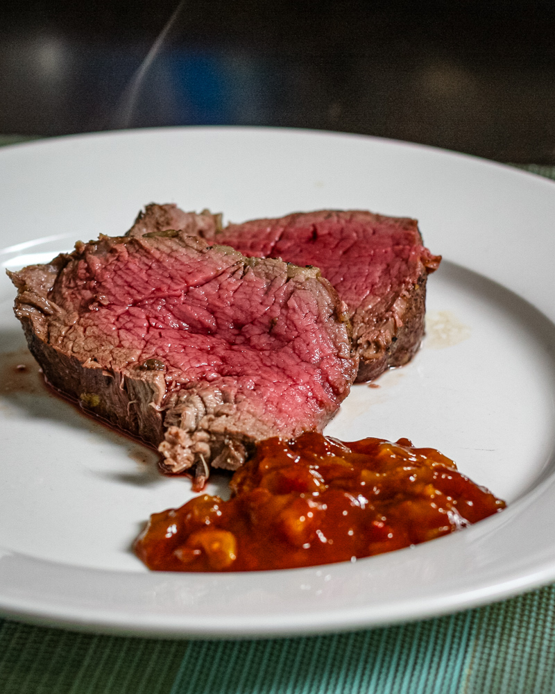 Henry Bain sauce alongside slices of roast beef tenderloin.