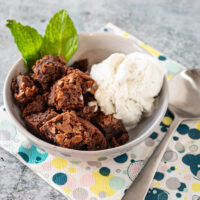 hot fudge cake cut into squares and served with vanilla ice cream