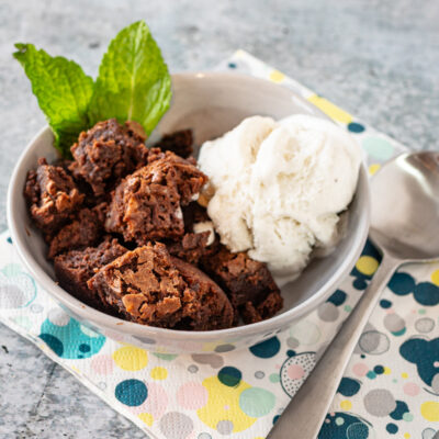 hot fudge cake cut into squares and served with vanilla ice cream