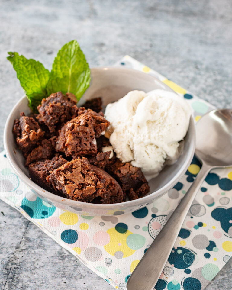 hot fudge cake cut into squares and served with vanilla ice cream