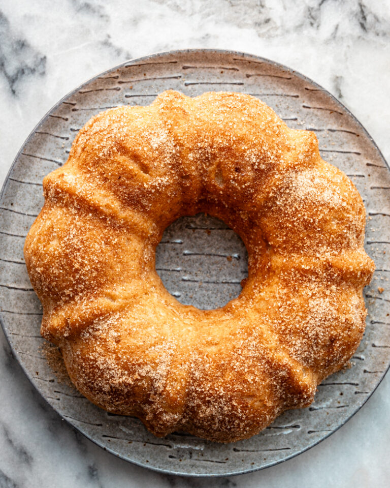 Instant Pot doughnut cake with cinnamon sugar topping.