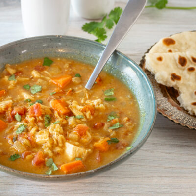 A bowl of chicken mulligatawny soup cooked in the Instant Pot pressure cooker.