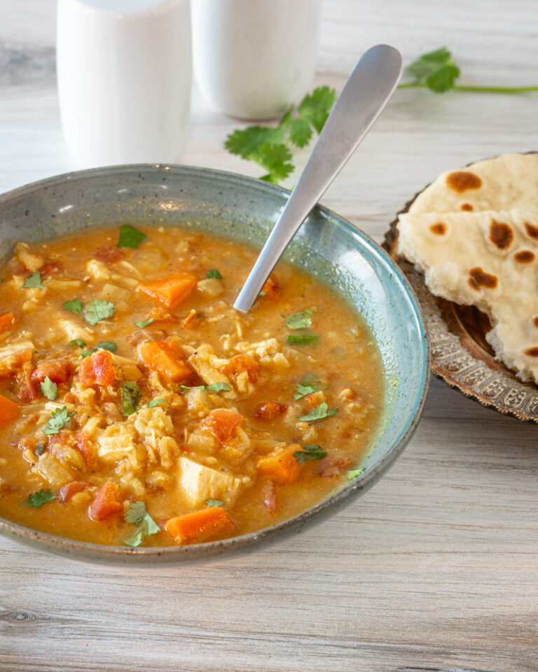 A bowl of chicken mulligatawny soup cooked in the Instant Pot pressure cooker.