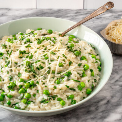 Creamy risotto with green peas and grated cheese.