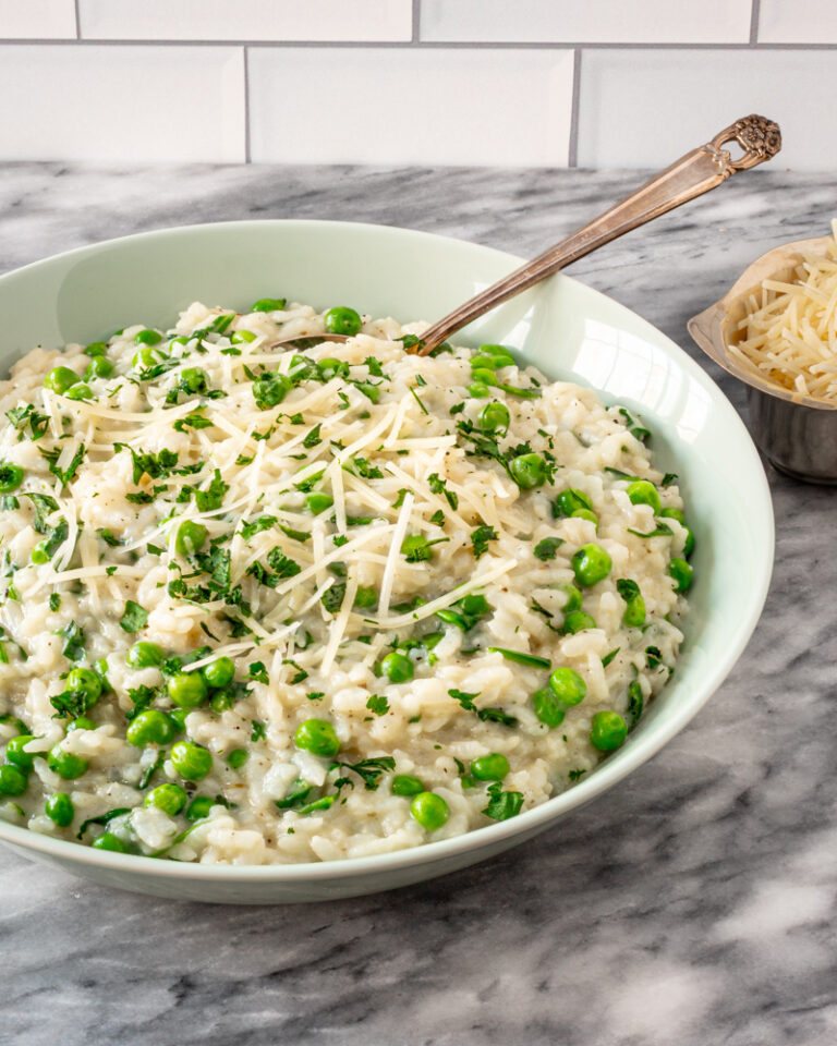 Creamy risotto with green peas and grated cheese.
