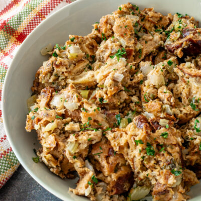 Instant Pot stuffing in a green serving bowl, cooked and ready to enjoy.
